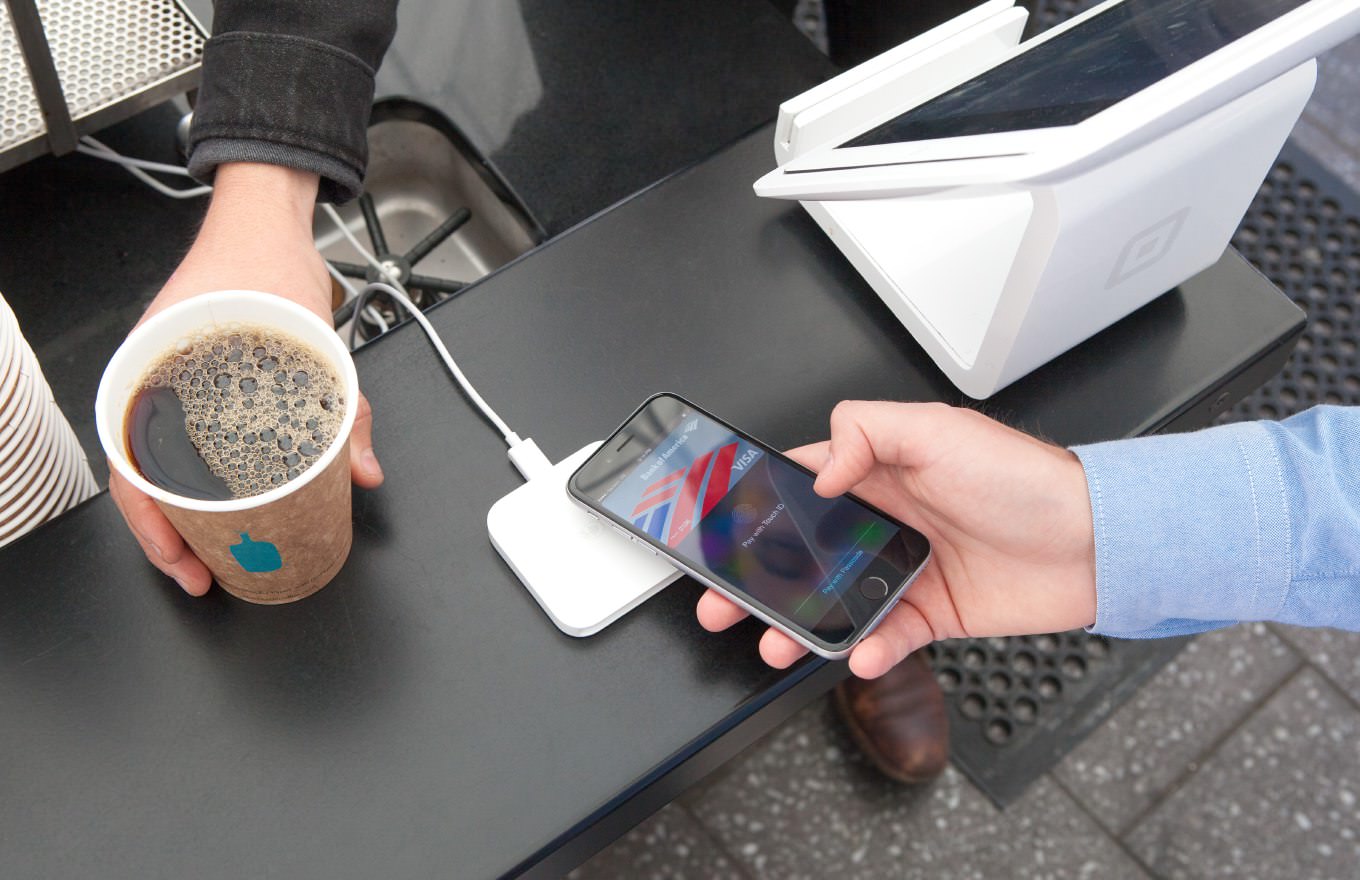 Paying for coffee with Square's Apple Pay reader. Author: Mybloodtypeiscoffee, licensed under Creative Commons.